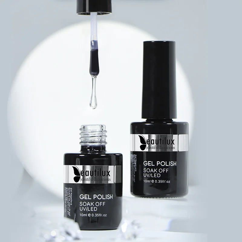 Two black Beautilux gel polish bottles and an applicator brush showing clear gel.